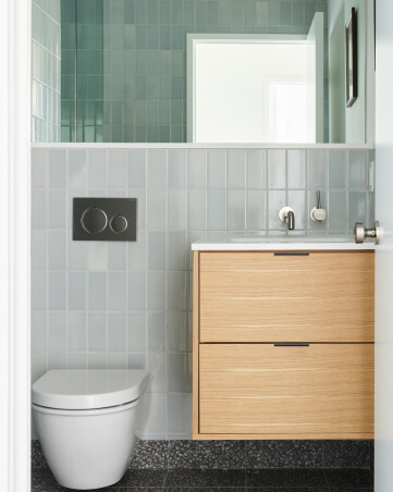 Oak bathroom vanity in a multi-family development